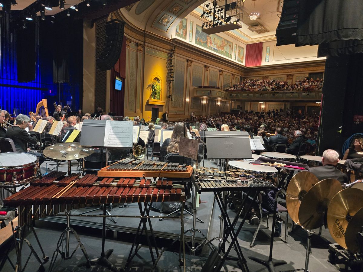 Marimba, xylophone and cymbals set up behind the orchestra before a sold-out concert