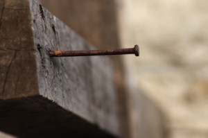 Nail in a wooden cross